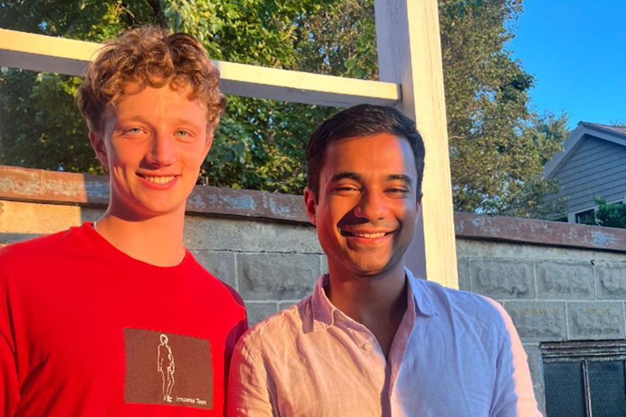 Sam Nashel and Mihir Sharma standing side by side and smiling at the camera