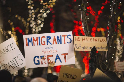 Immigration posters at rally.